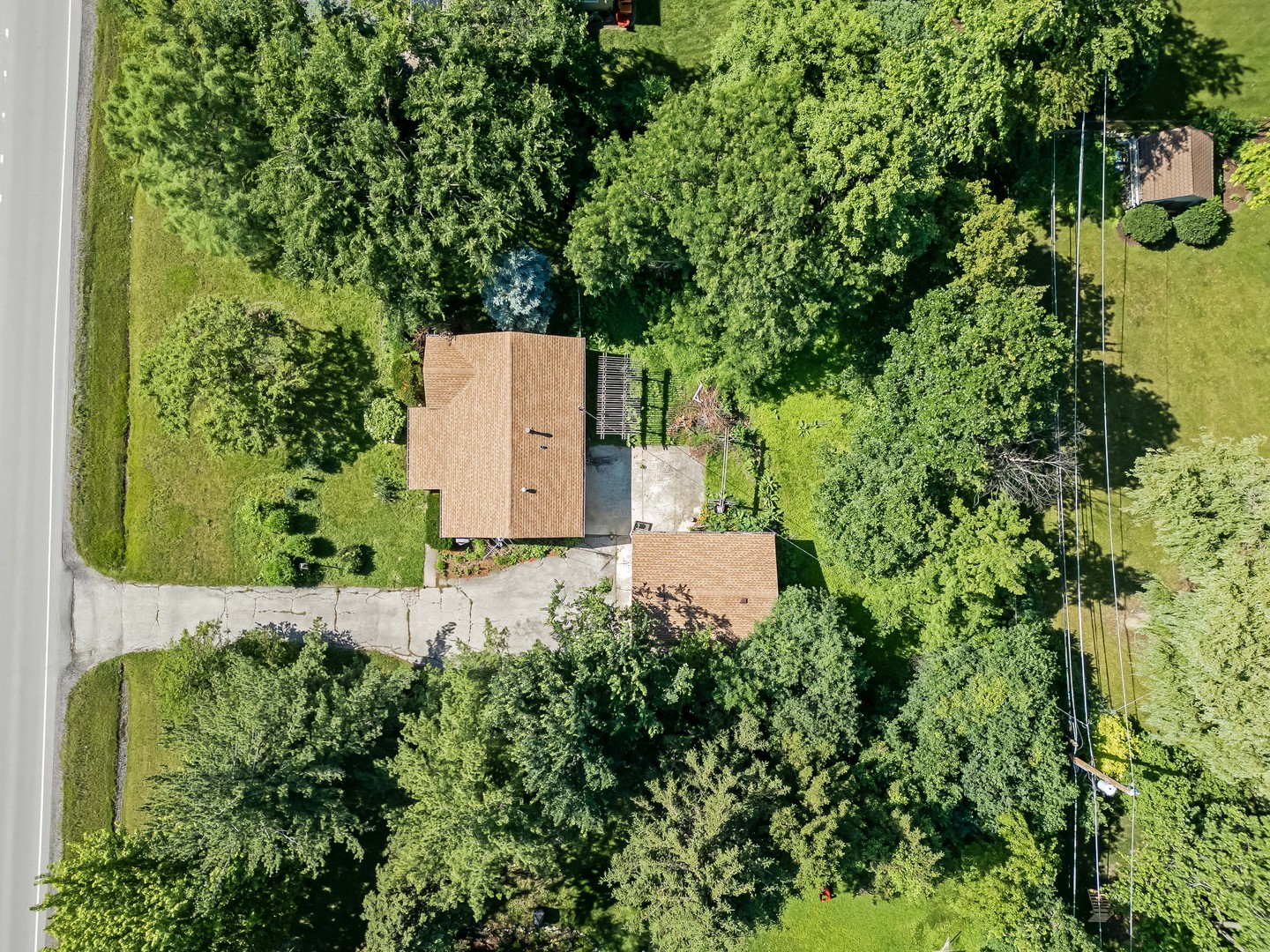 5736 Willow Springs Road La Grange Highlands, IL 60525 - Photo 2 of 14 an aerial view of a house with a yard and tennis court