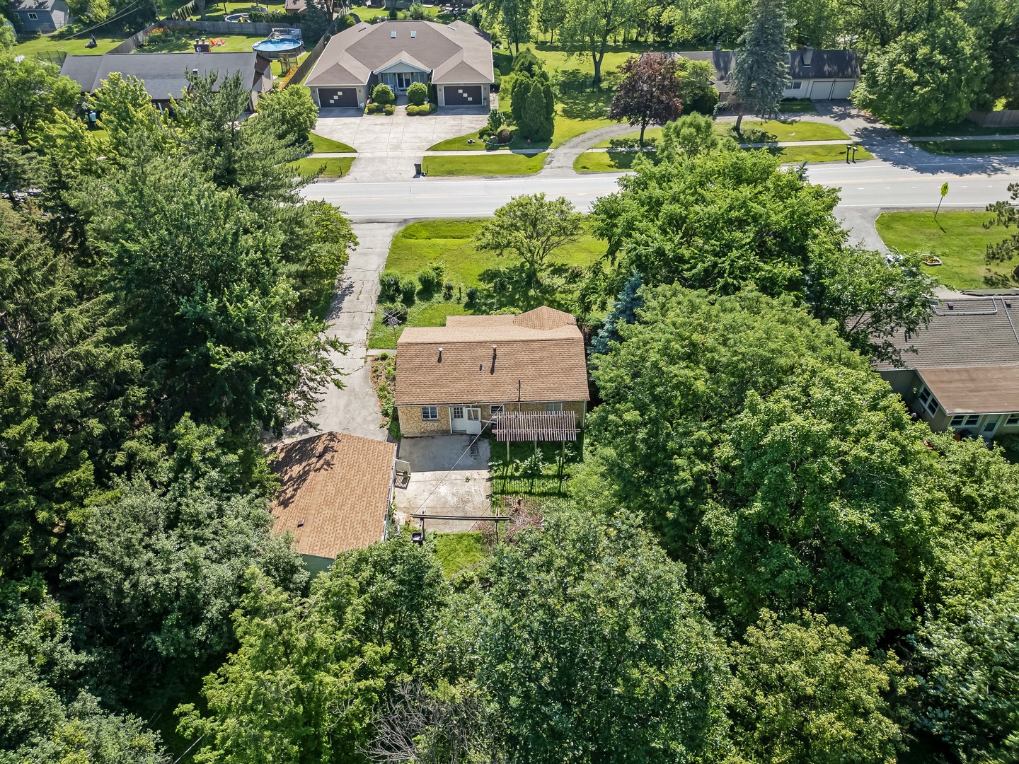 5736 Willow Springs Road La Grange Highlands, IL 60525 - Photo 7 of 14 an aerial view of a house with a garden and swimming pool