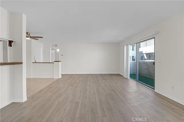 a kitchen with kitchen island a sink appliances and a counter top space