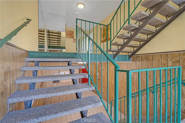 a bathroom with a sink and mirror with window