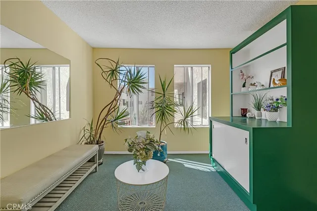 a view of parking garage with cars parked