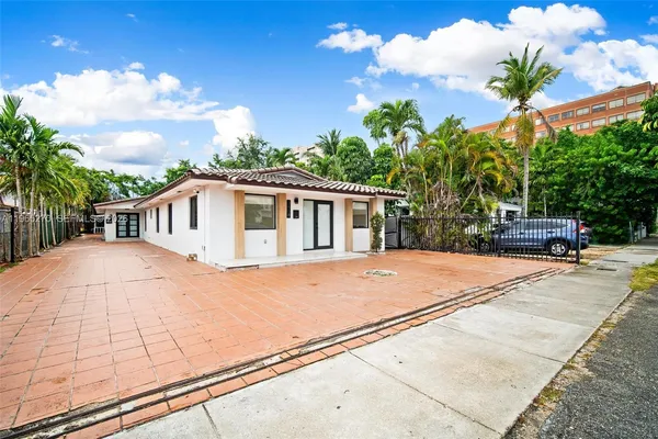 a house with trees in the background