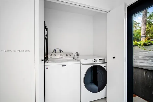 a utility room with dryer and washer
