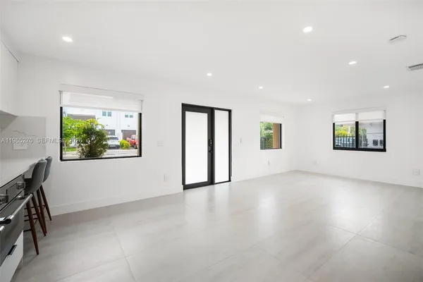 a view of an empty room with a window