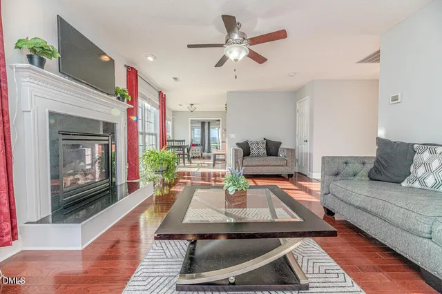 a living room with furniture and a rug