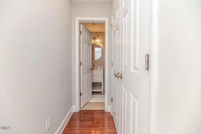 a bedroom with furniture and a large window