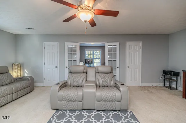 a bathroom with a toilet a sink and a shower