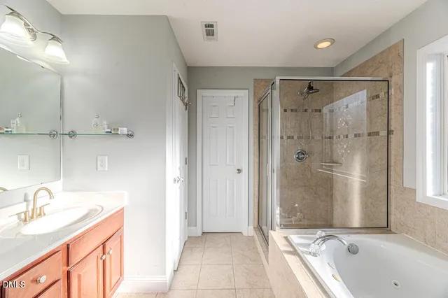 a room with patio furniture and a floor to ceiling window