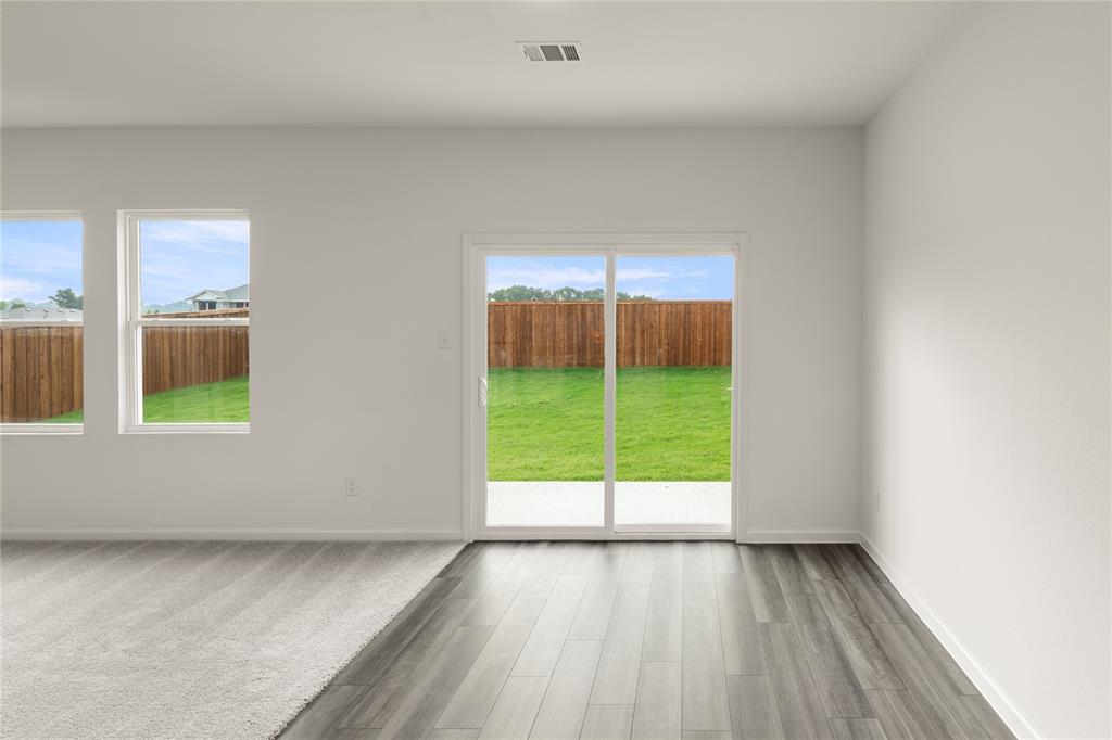 1324 Kennedy Road Howe, TX 75459 - Photo 15 of 29 an empty room with window & wooden door