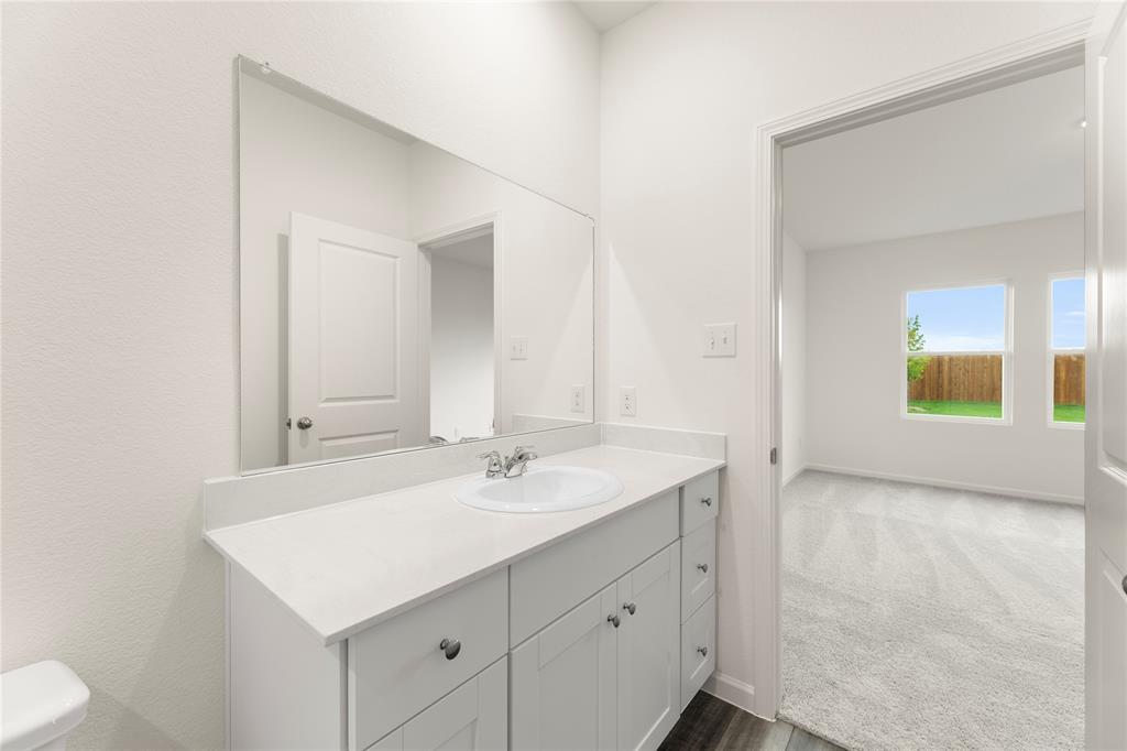 1324 Kennedy Road Howe, TX 75459 - Photo 21 of 29 a bathroom with a sink and a mirror