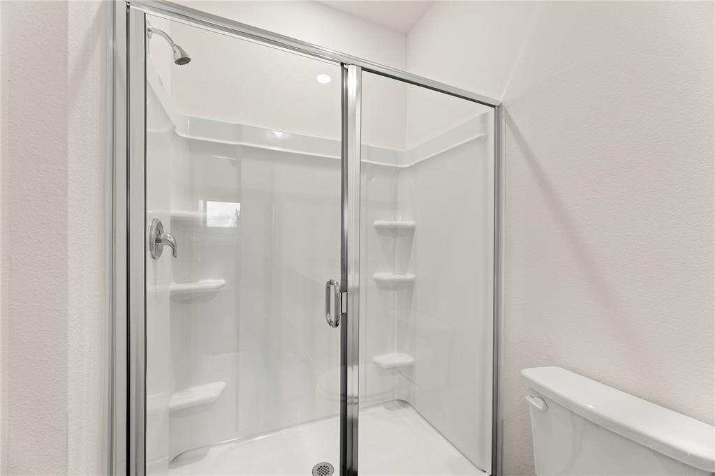 1324 Kennedy Road Howe, TX 75459 - Photo 22 of 29 a bathroom with a shower and a toilet