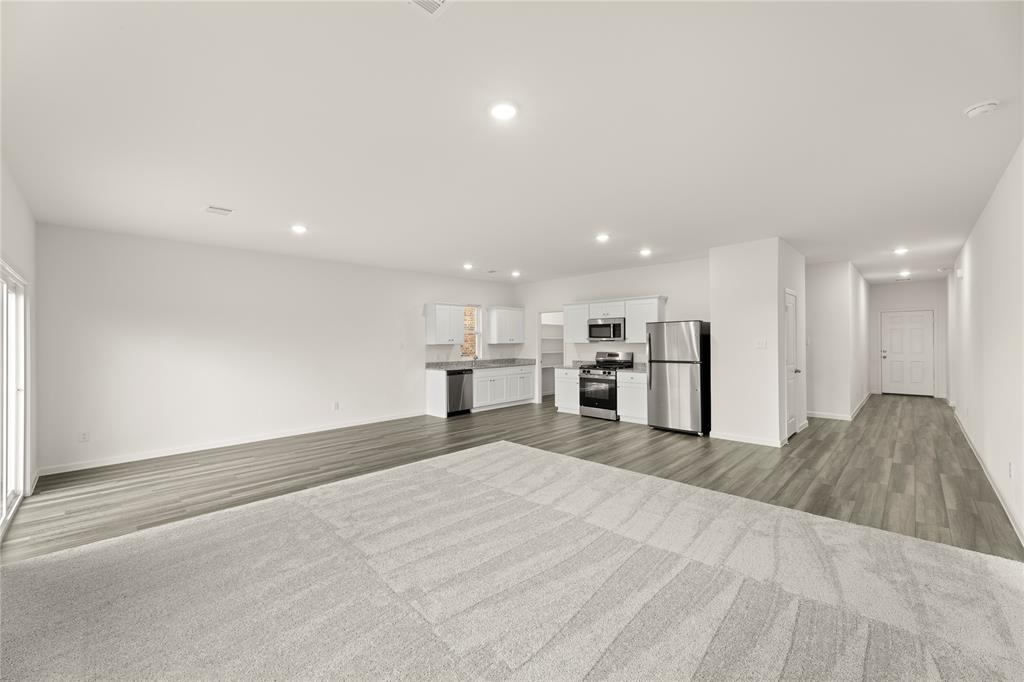 1324 Kennedy Road Howe, TX 75459 - Photo 8 of 29 a view of large kitchen with kitchen island sink and refrigerator