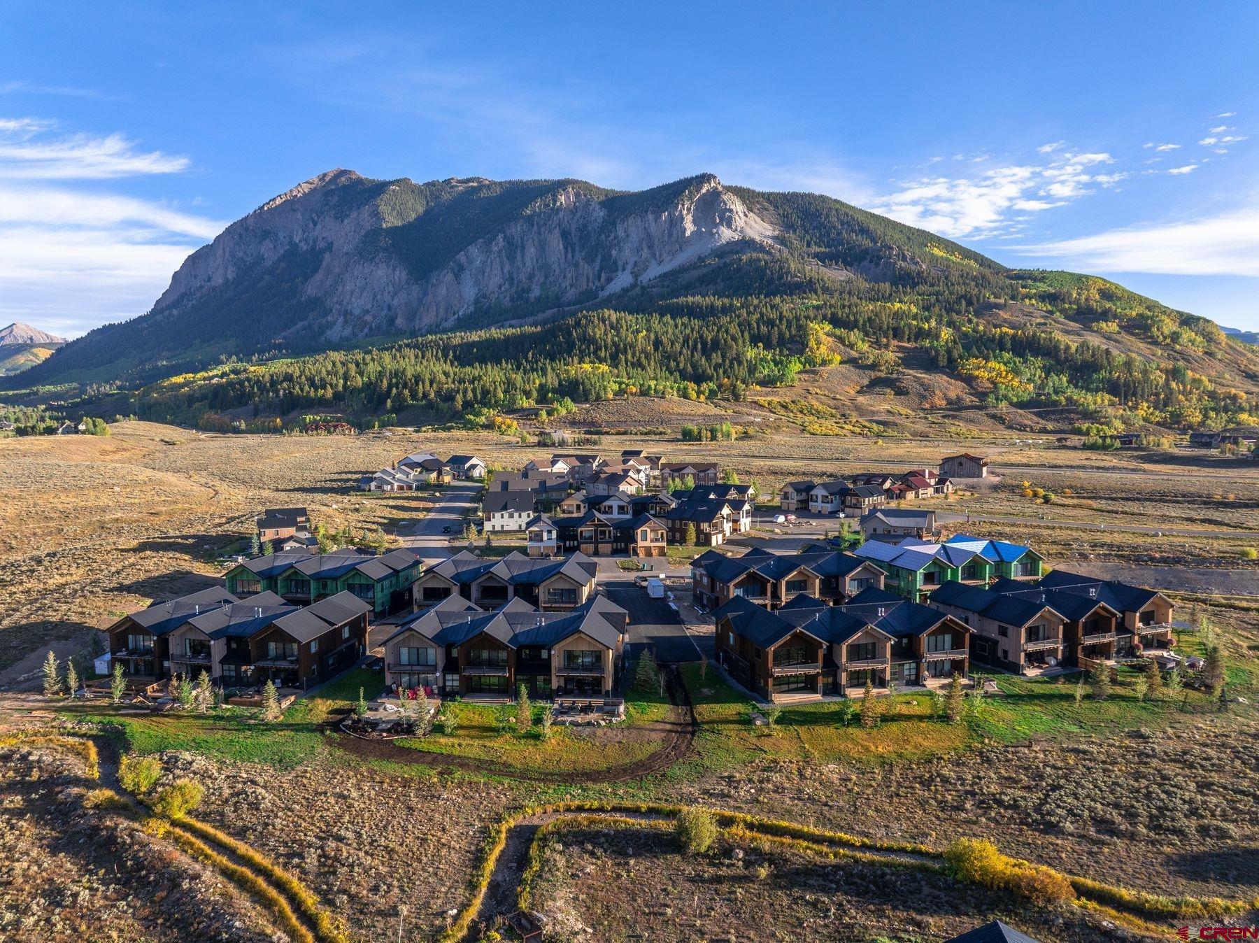 180 Elk Valley Road, Unit 108 Crested Butte, CO 81224 - Photo 18 of 28 a view of a lake with a mountain in the background