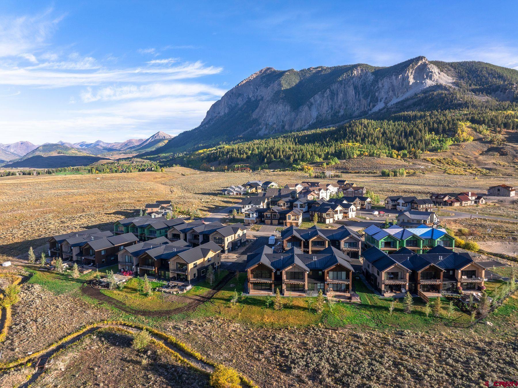 180 Elk Valley Road, Unit 108 Crested Butte, CO 81224 - Photo 20 of 28 a view of a lake with a yard