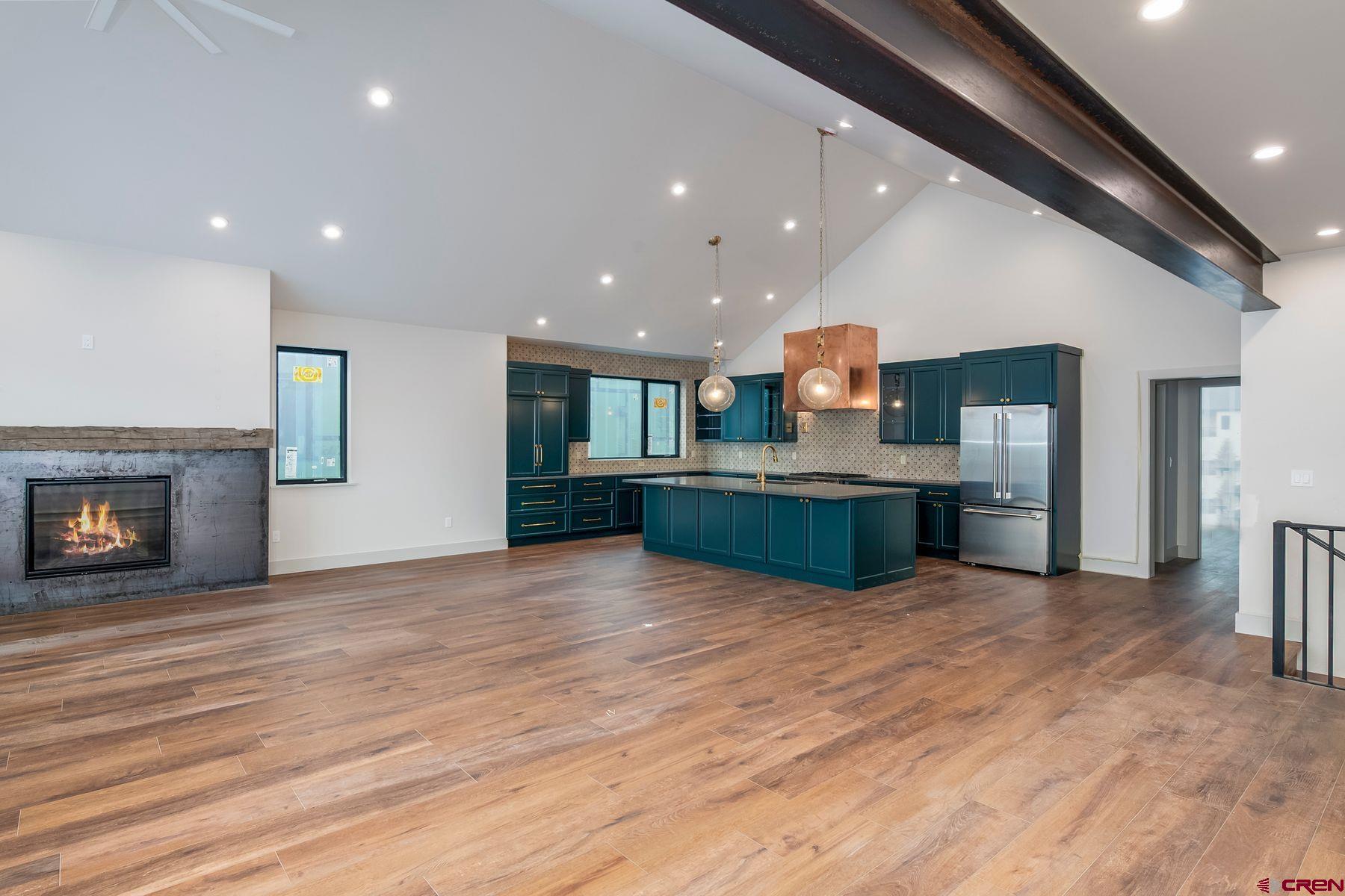 180 Elk Valley Road, Unit 108 Crested Butte, CO 81224 - Photo 3 of 28 a view of kitchen with wooden floor