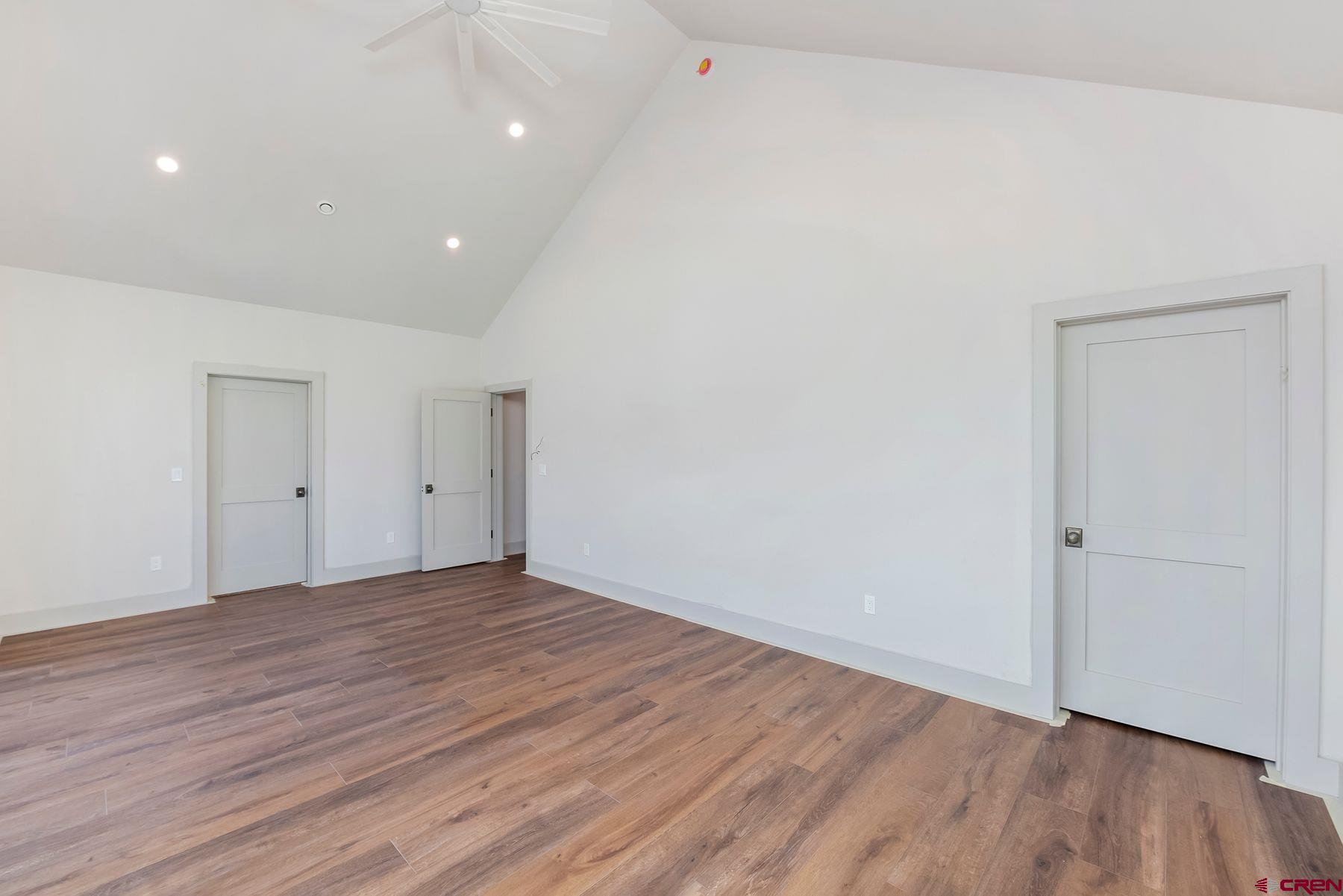 180 Elk Valley Road, Unit 108 Crested Butte, CO 81224 - Photo 9 of 28 a view of an empty room with wooden floor and closet