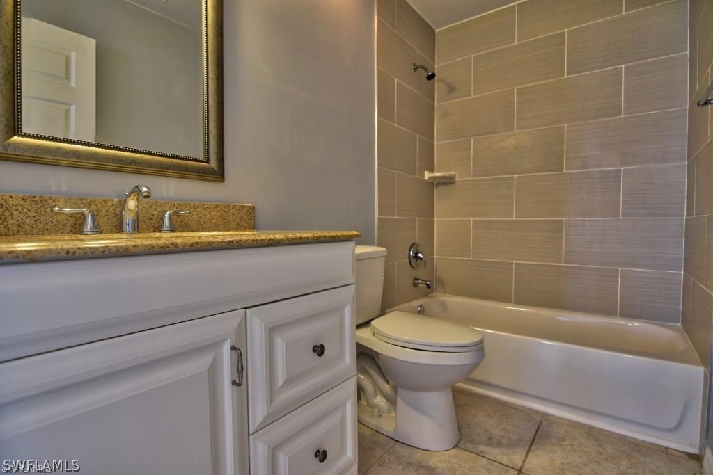 8128 Anhinga Road Fort Myers, FL 33967 - Photo 11 of 12 a bathroom with a sink toilet and shower