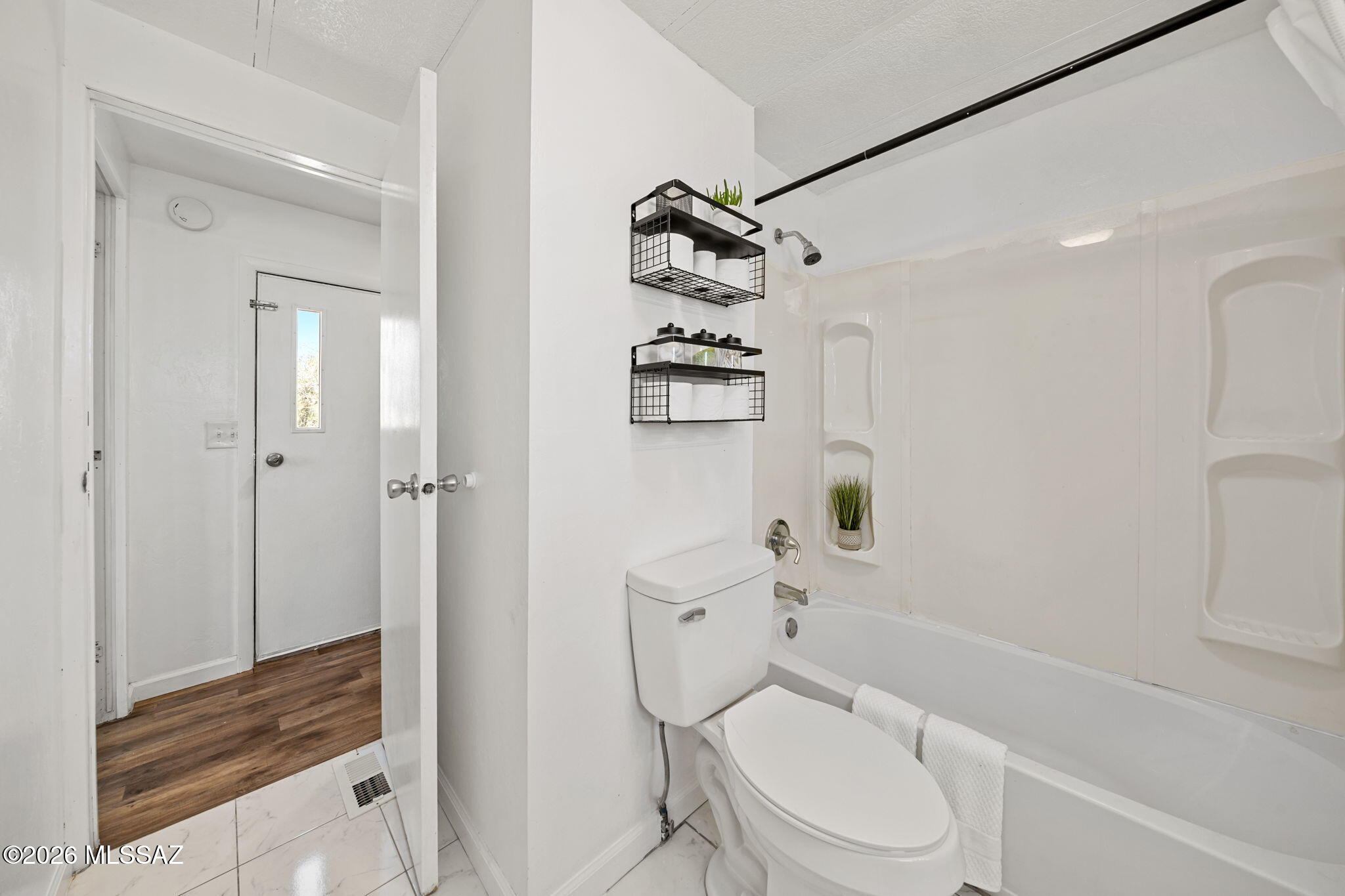 13140 West El Lobo Road Tucson, AZ 85743 - Photo 16 of 30 Featuring a shower/tub combo in the hallway for your convenience.