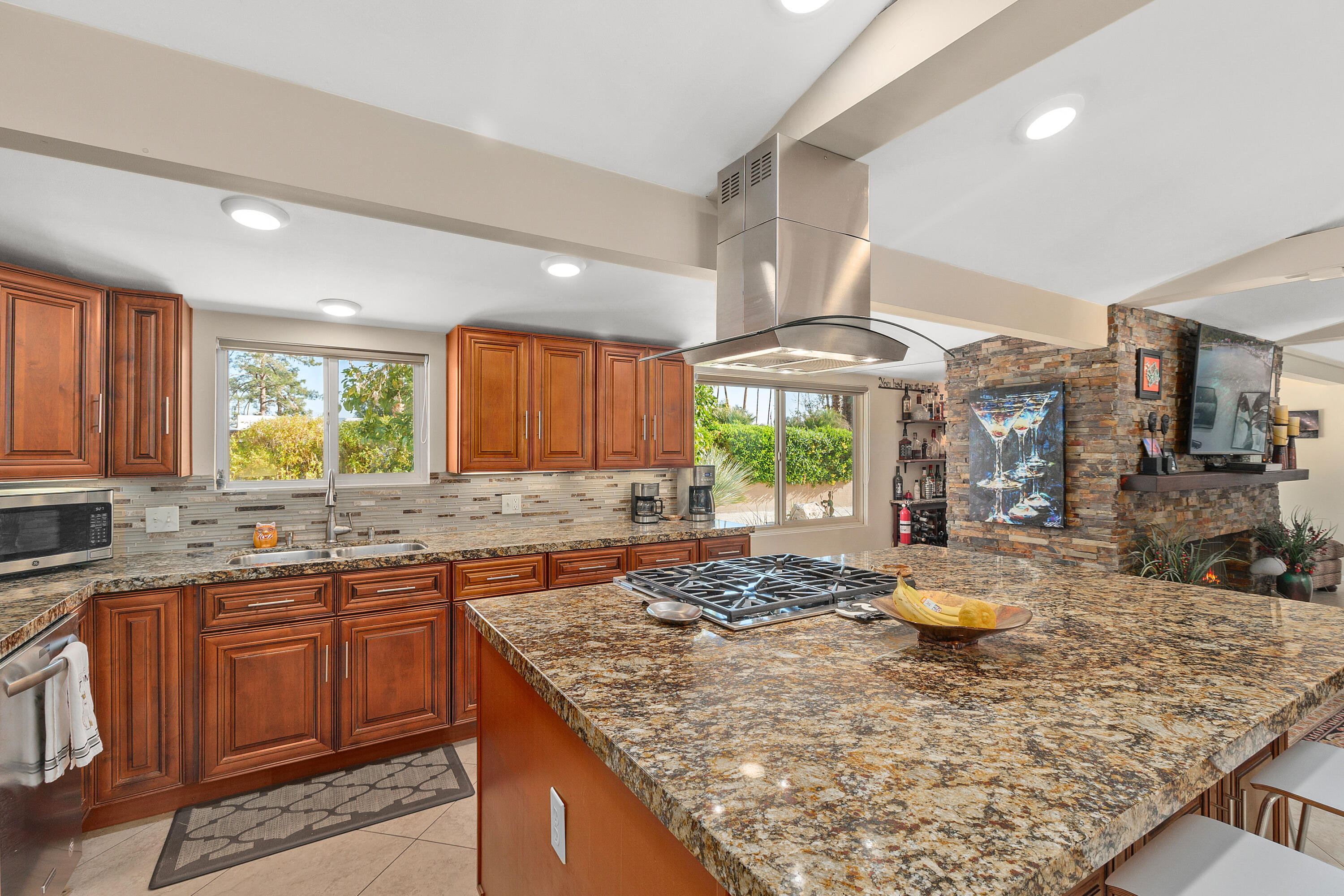 70801 Fairway Drive Rancho Mirage, CA 92270 - Photo 20 of 48 a kitchen with a stove a sink refrigerator and cabinets