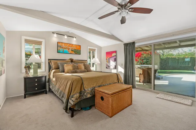 a spacious bedroom with a bed and window