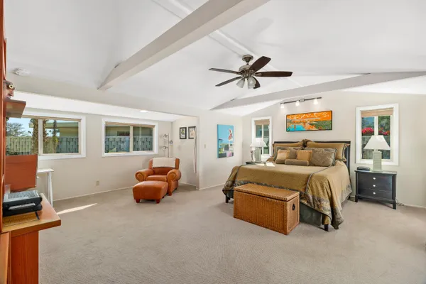a bed room with a bed and a large window