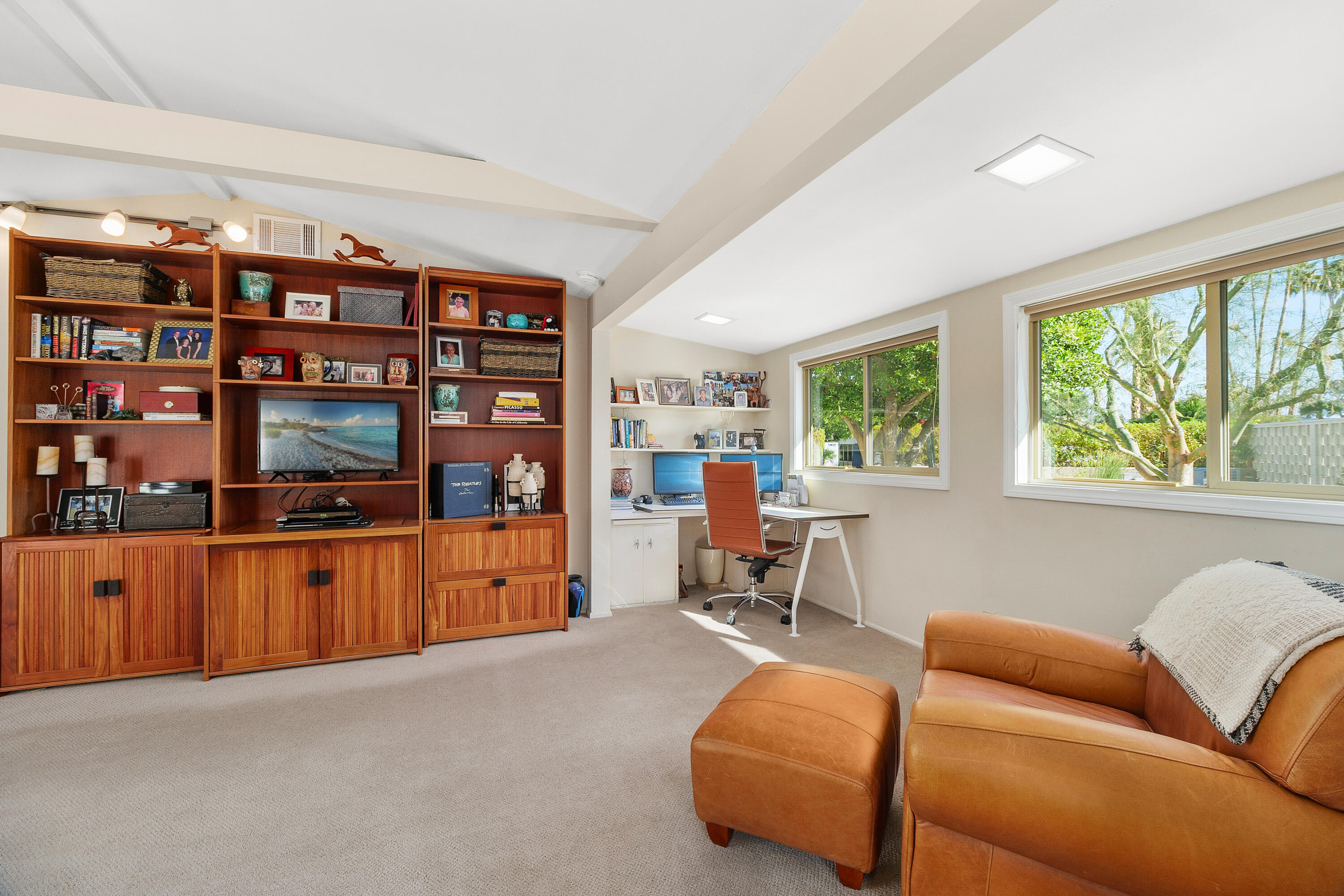 70801 Fairway Drive Rancho Mirage, CA 92270 - Photo 25 of 48 a living room with furniture and a flat screen tv
