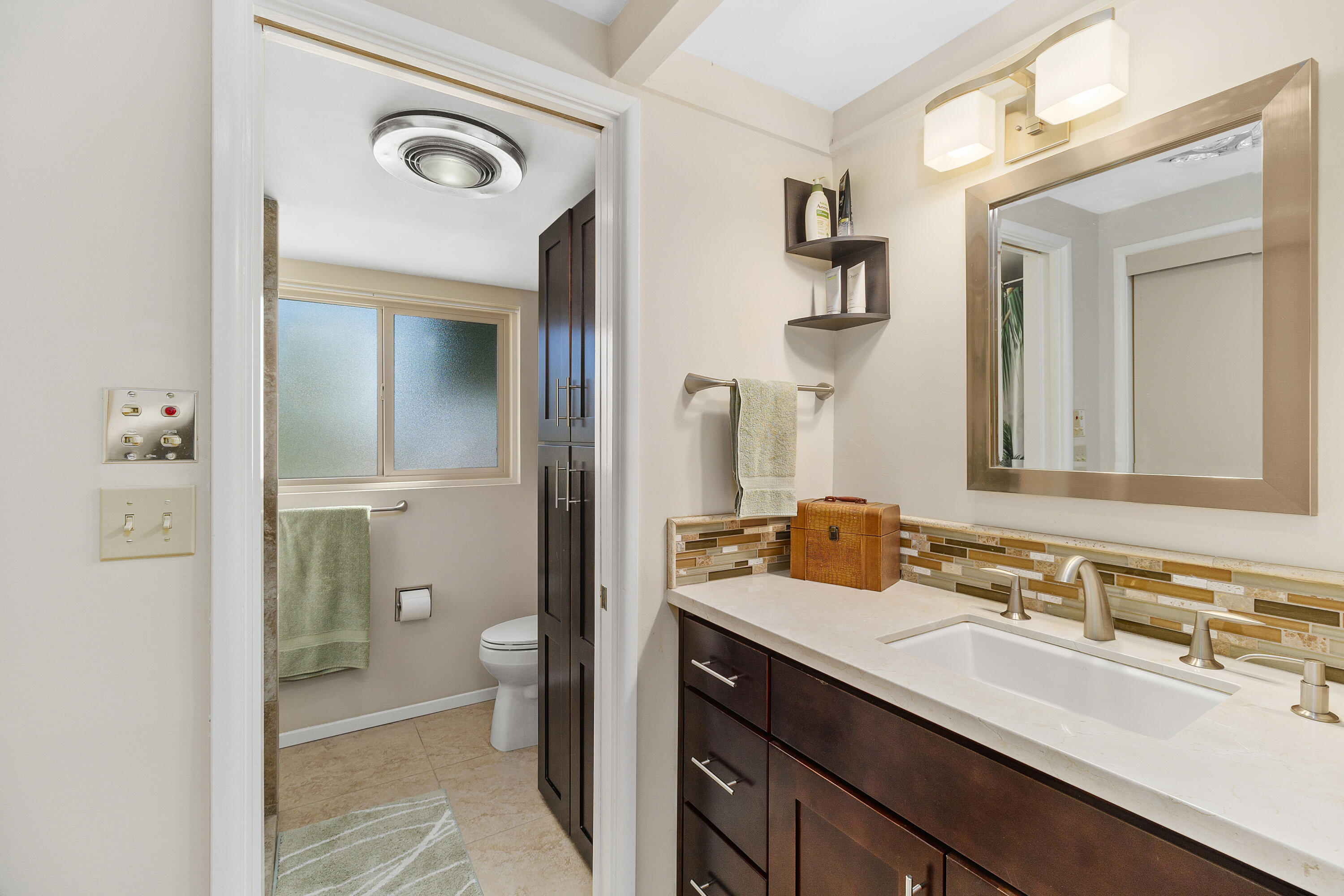 70801 Fairway Drive Rancho Mirage, CA 92270 - Photo 26 of 48 a bathroom with a double vanity sink toilet and shower