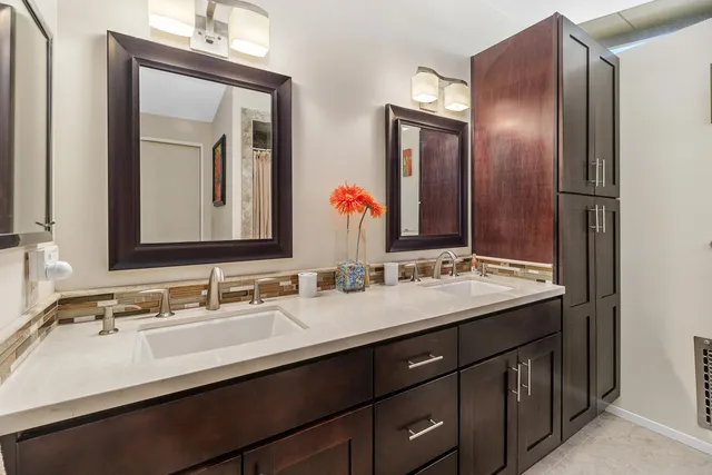 a bathroom with a shower and a sink