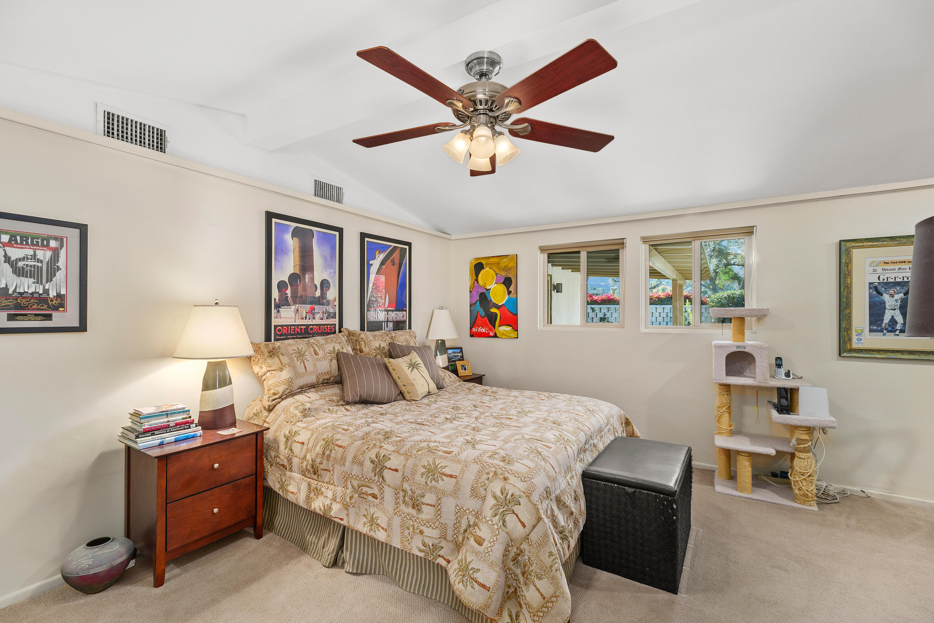 70801 Fairway Drive Rancho Mirage, CA 92270 - Photo 31 of 48 a bedroom with a bed and a chandelier