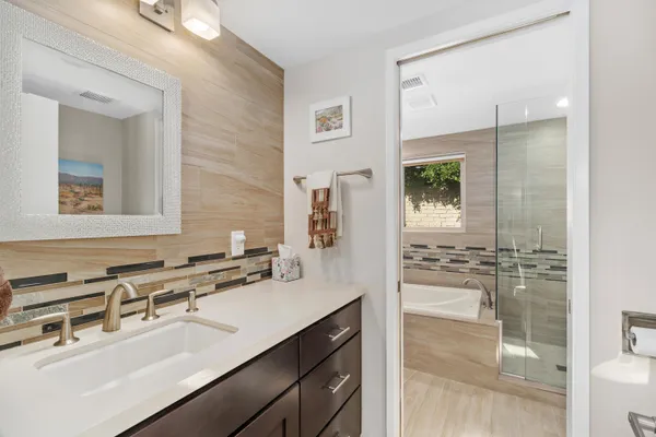 a bathroom with a bathtub and a sink