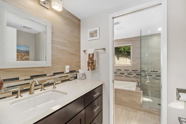 a bathroom with a bathtub and a sink
