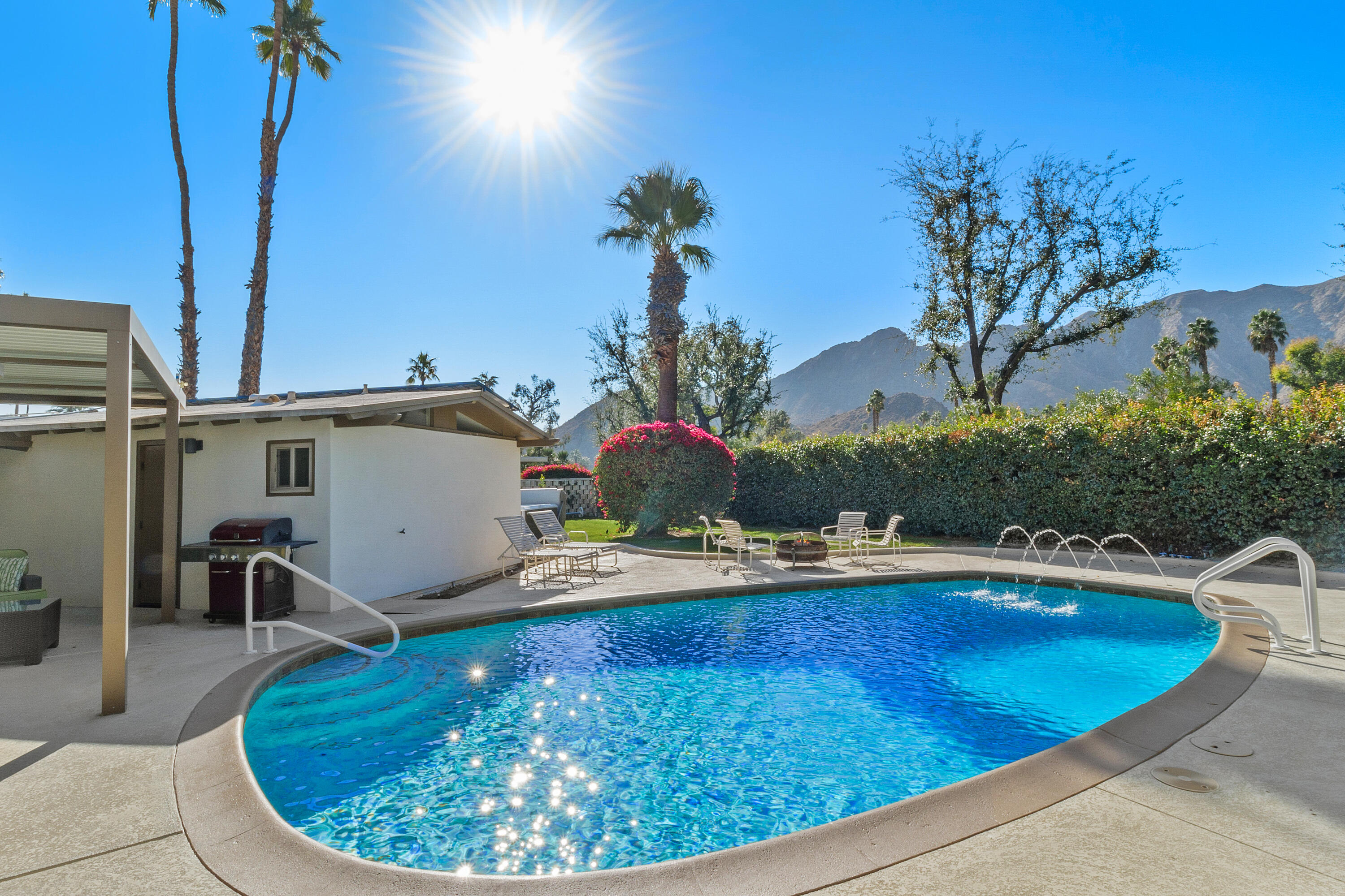 70801 Fairway Drive Rancho Mirage, CA 92270 - Photo 40 of 48 a view of a swimming pool with an outdoor seating