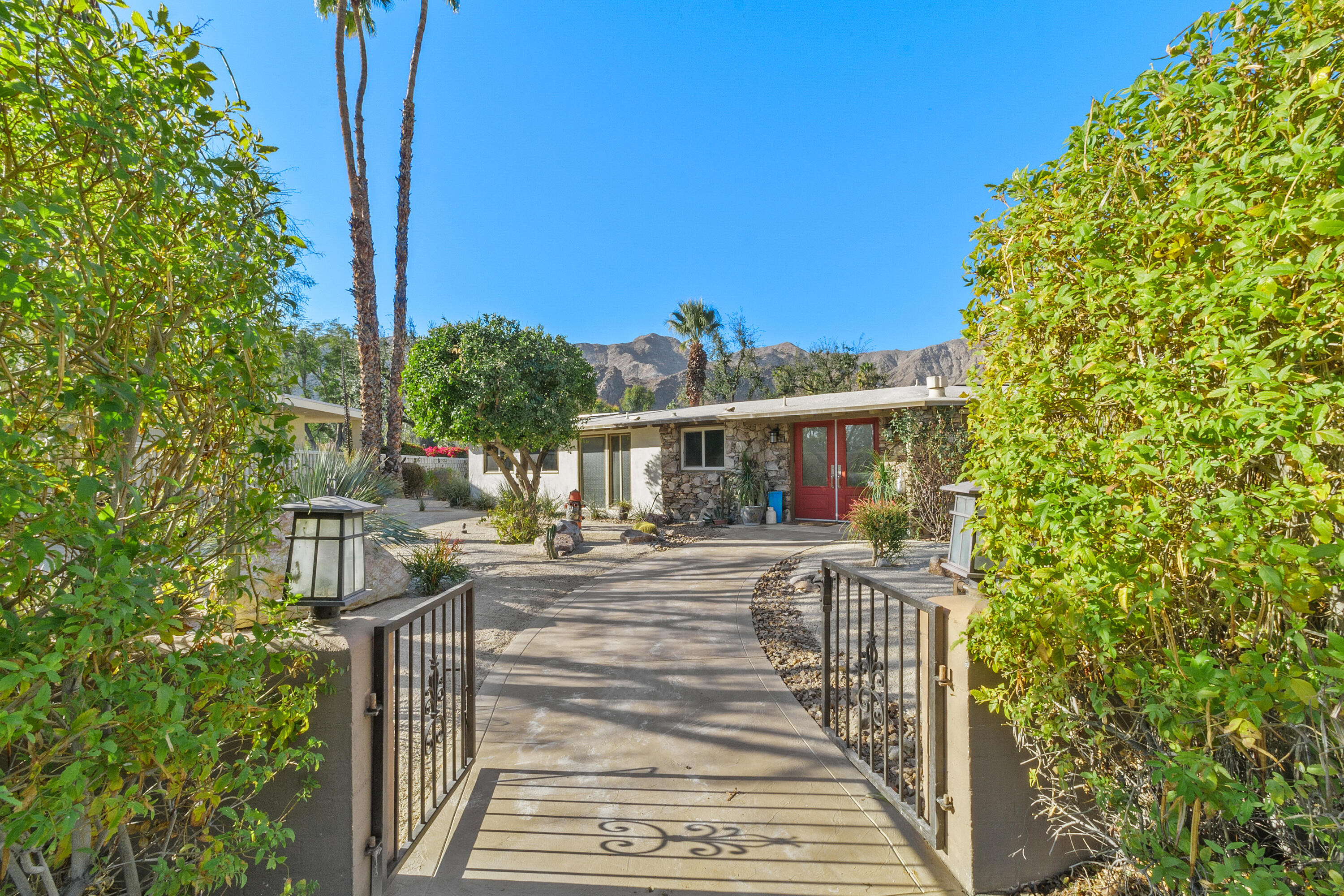 70801 Fairway Drive Rancho Mirage, CA 92270 - Photo 5 of 48 a view of a house with a small yard