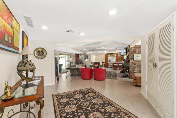 a living room with furniture rug and window