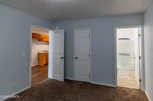 a bathroom with a shower a toilet and a sink