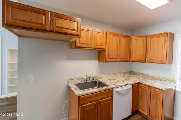 a kitchen with a stove and a cabinet