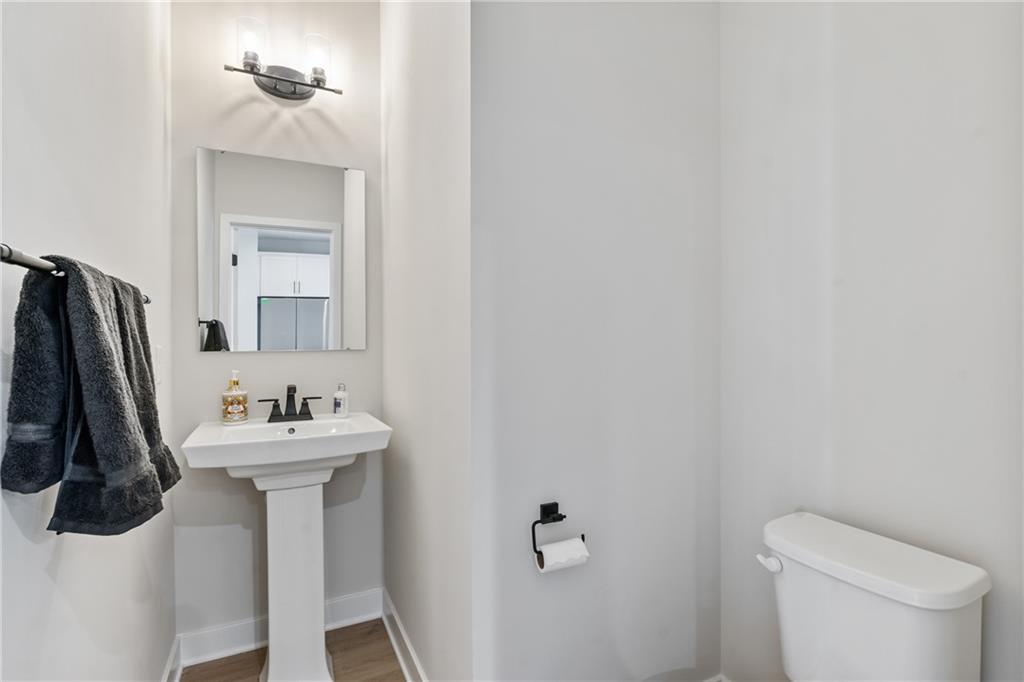 4608 Spruce Road Gibsonia, PA 15044 - Photo 16 of 32 a bathroom with a sink toilet and a mirror