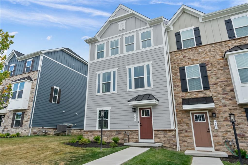 4608 Spruce Road Gibsonia, PA 15044 - Photo 2 of 32 a front view of a house with garden