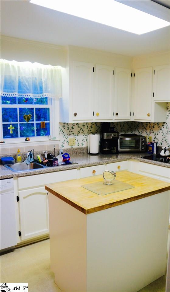 432 Piney Grove Road Greenville, SC 29607 - Photo 4 of 34 Painted white cabinets & butcher block island for preparing meals