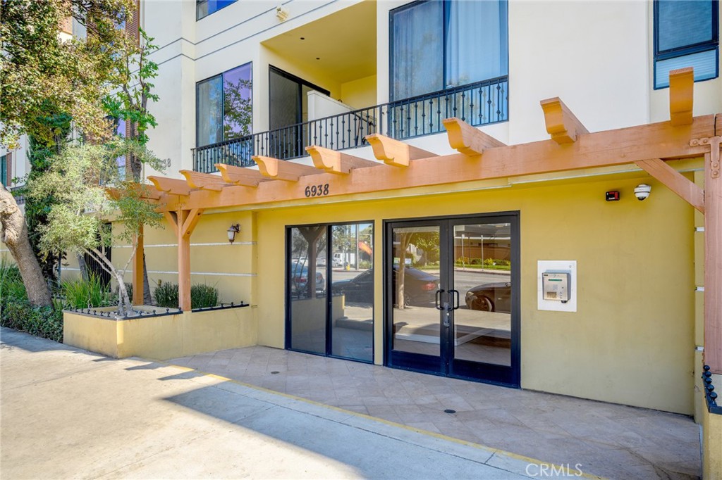 6938 Laurel Canyon Boulevard, Unit 101 North Hollywood, CA 91605 - Photo 2 of 32 a view of a building with door