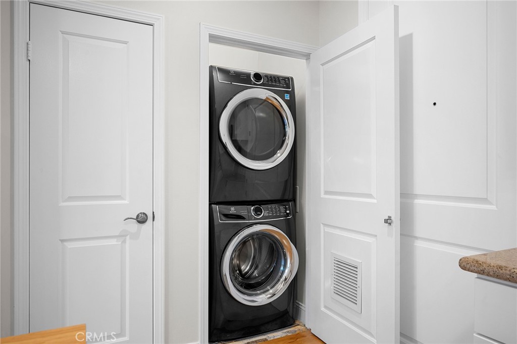 6938 Laurel Canyon Boulevard, Unit 101 North Hollywood, CA 91605 - Photo 24 of 32 a utility room with dryer and washer