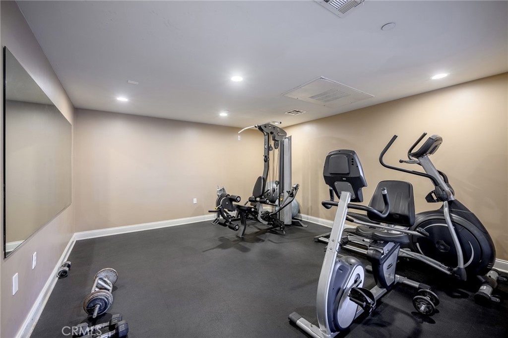 6938 Laurel Canyon Boulevard, Unit 101 North Hollywood, CA 91605 - Photo 27 of 32 a view of a room with gym equipment