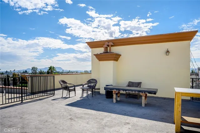 a terrace of a house with outdoor seating
