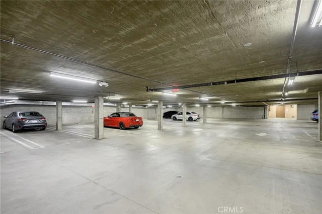a view of parking garage with cars