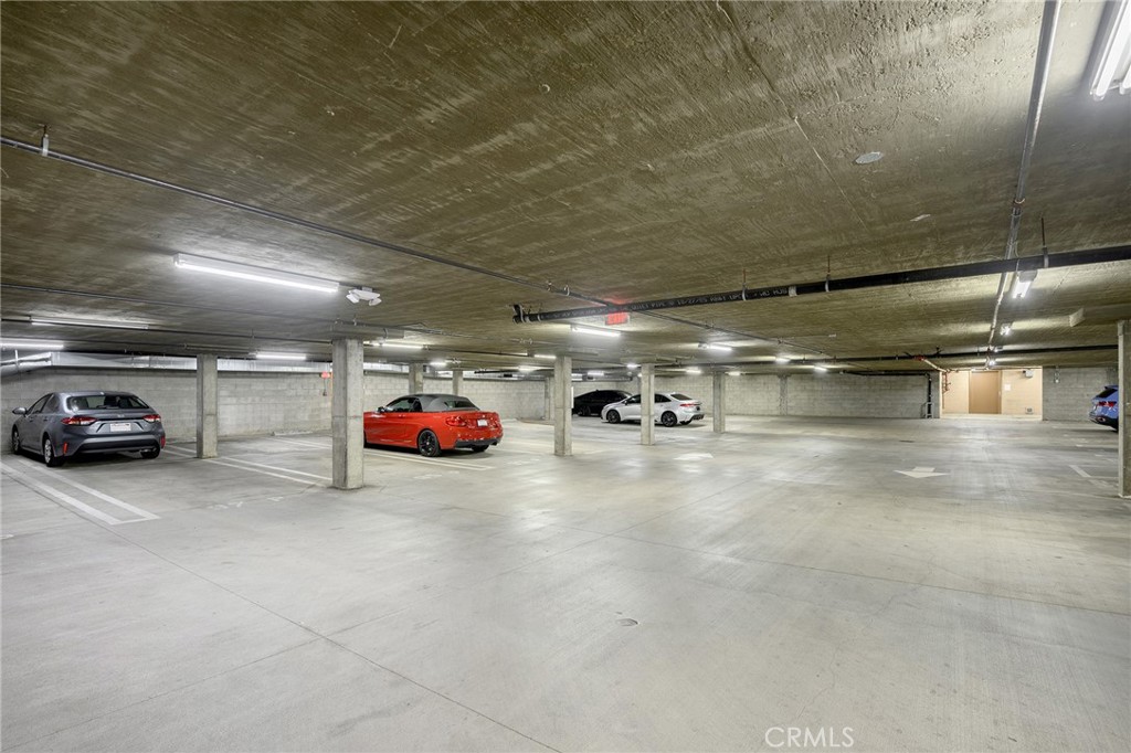 6938 Laurel Canyon Boulevard, Unit 101 North Hollywood, CA 91605 - Photo 30 of 32 a view of parking garage with cars