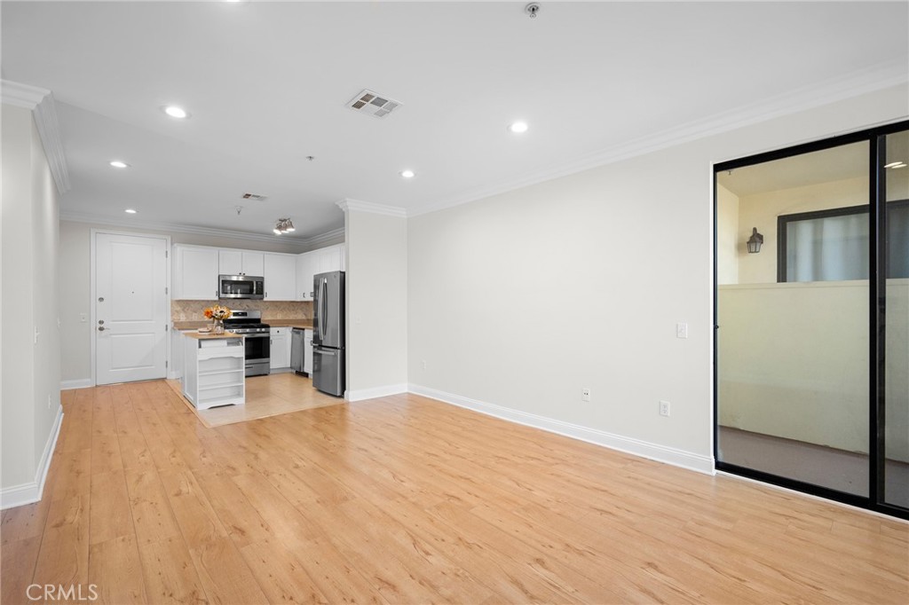 6938 Laurel Canyon Boulevard, Unit 101 North Hollywood, CA 91605 - Photo 7 of 32 a view of kitchen with stainless steel appliances kitchen island
