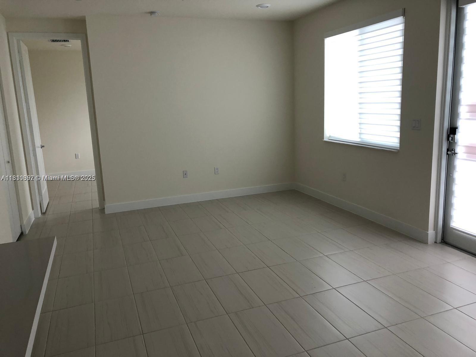 Doral Doral, FL 33178 - Photo 2 of 5 an empty room with windows