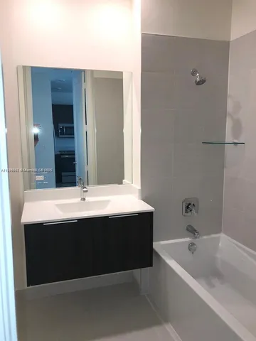 a bathroom with a sink and a bathtub
