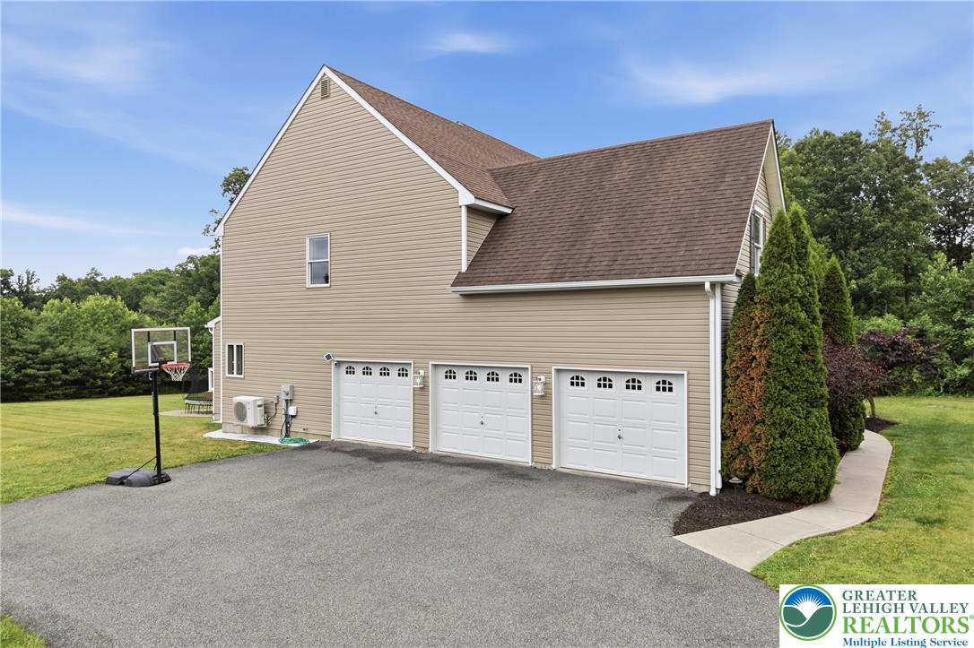 1212 Miller Road Wind Gap, PA 18091 - Photo 56 of 72 A well-maintained three-car garage provides ample storage and utility for this inviting residence.