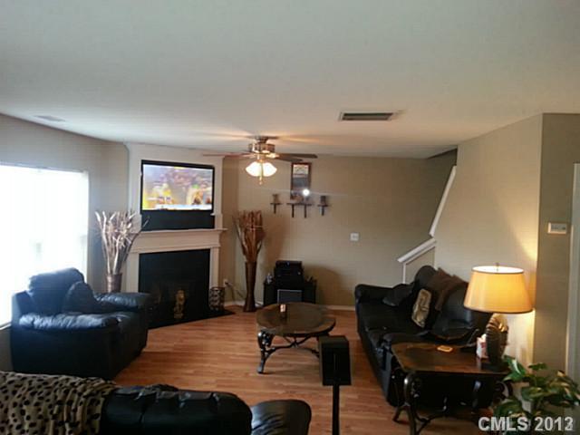 1611 Rustic Arch Way Huntersville, NC 28078 - Photo 2 of 3 a living room with furniture and a fireplace